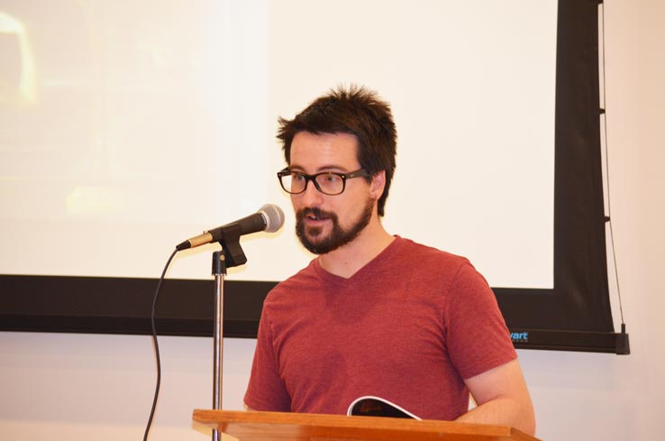 A student speaking into a microphone.